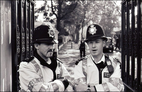 Police block the path to the embassy.